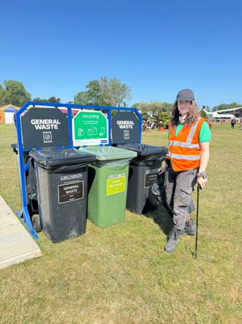 Crew Member With Litter Pick By The Bins