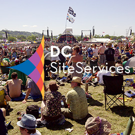 DC Site Services logo over Glastonbury Festival Pyramid Stage photo