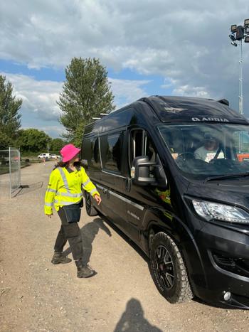 Staff Guiding Traffic Pink Hat Face On