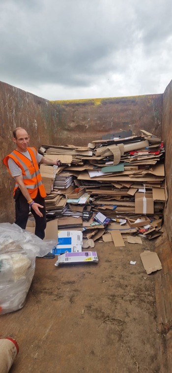 David With Stacked Cardboard