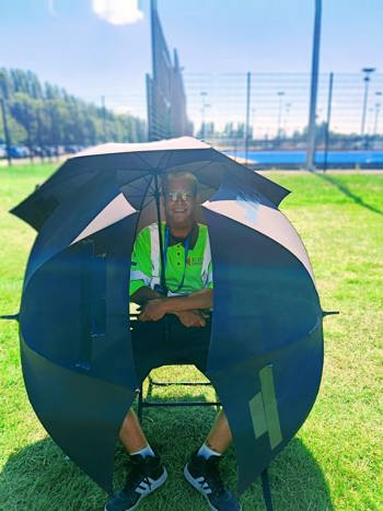 Byron Surrounded By Umbrellas