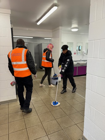 Staff Cleaning Bathroom