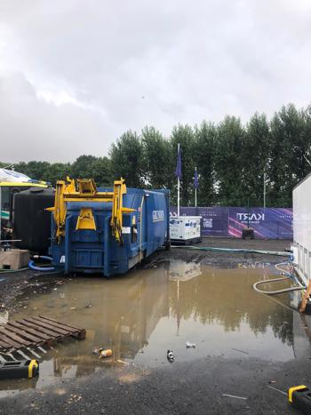 Compactor Next To Massive Puddle